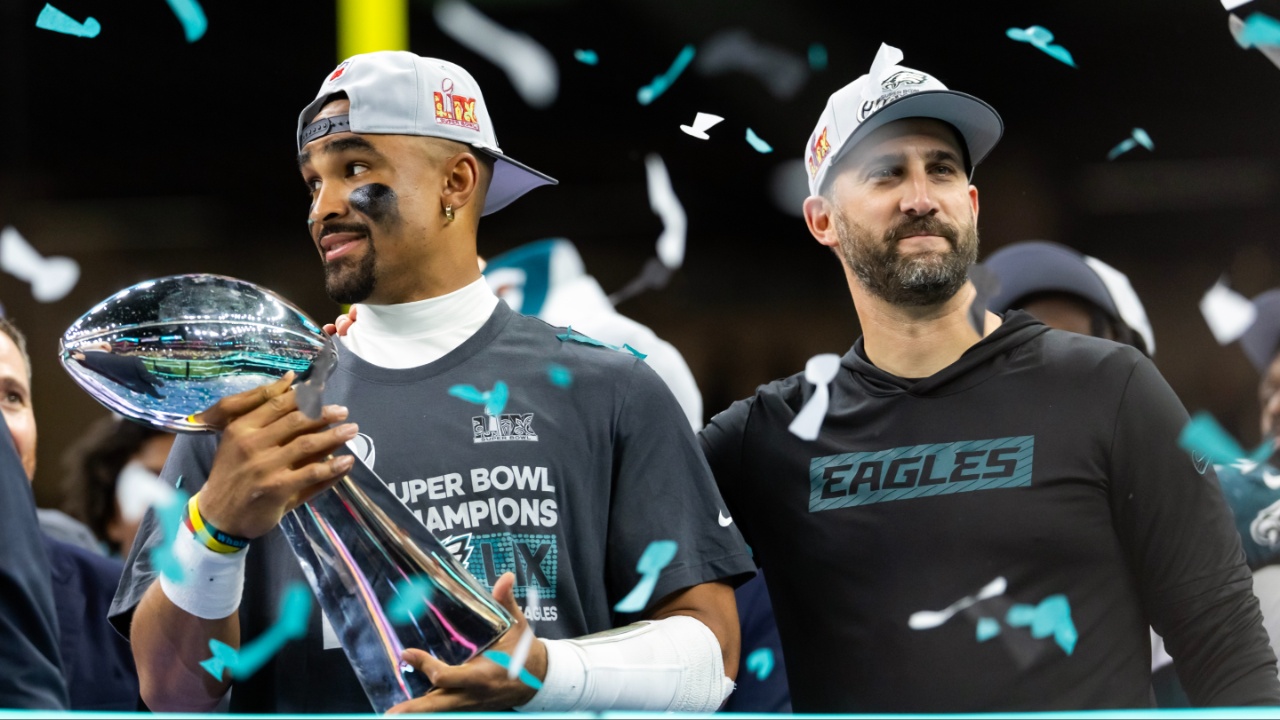 Philadelphia Eagles quarterback Jalen Hurts (left) and head coach Nick Sirianni celebrate with the Vince Lombardi Trophy after defeating the Kansas City Chiefs during Super Bowl LIX at Ceasars Superdome.