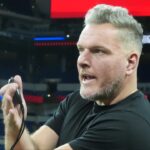 Pat McAfee watches workouts at the 2025 NFL Scouting Combine at Lucas Oil Stadium.