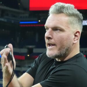 Pat McAfee watches workouts at the 2025 NFL Scouting Combine at Lucas Oil Stadium.