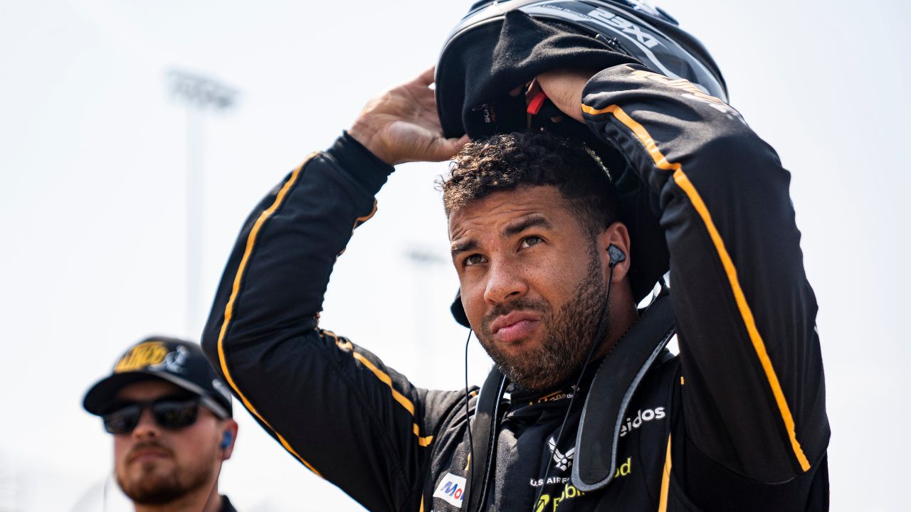 Bubba Wallace (23) puts on his helmet during NASCAR Cup Series qualifying on Aug. 2, 2025, at Iowa Speedway in Newton, Iowa.