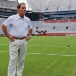 Alabama football coach Nick Saban stands on the turf inside Bryant-Denny Stadium during his team's media day in 2019.