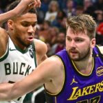 Los Angeles Lakers guard Luka Doncic (77) drives to the basket against Milwaukee Bucks forward Giannis Antetokounmpo (34) in the third quarter at Fiserv Forum.