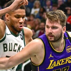 Los Angeles Lakers guard Luka Doncic (77) drives to the basket against Milwaukee Bucks forward Giannis Antetokounmpo (34) in the third quarter at Fiserv Forum.