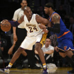 Mar 13, 2016; Los Angeles, CA, USA; Los Angeles Lakers forward Kobe Bryant (24) posts up on New York Knicks forward Carmelo Anthony (7) during the first quarter at Staples Center.