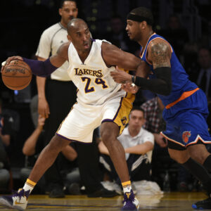Mar 13, 2016; Los Angeles, CA, USA; Los Angeles Lakers forward Kobe Bryant (24) posts up on New York Knicks forward Carmelo Anthony (7) during the first quarter at Staples Center.