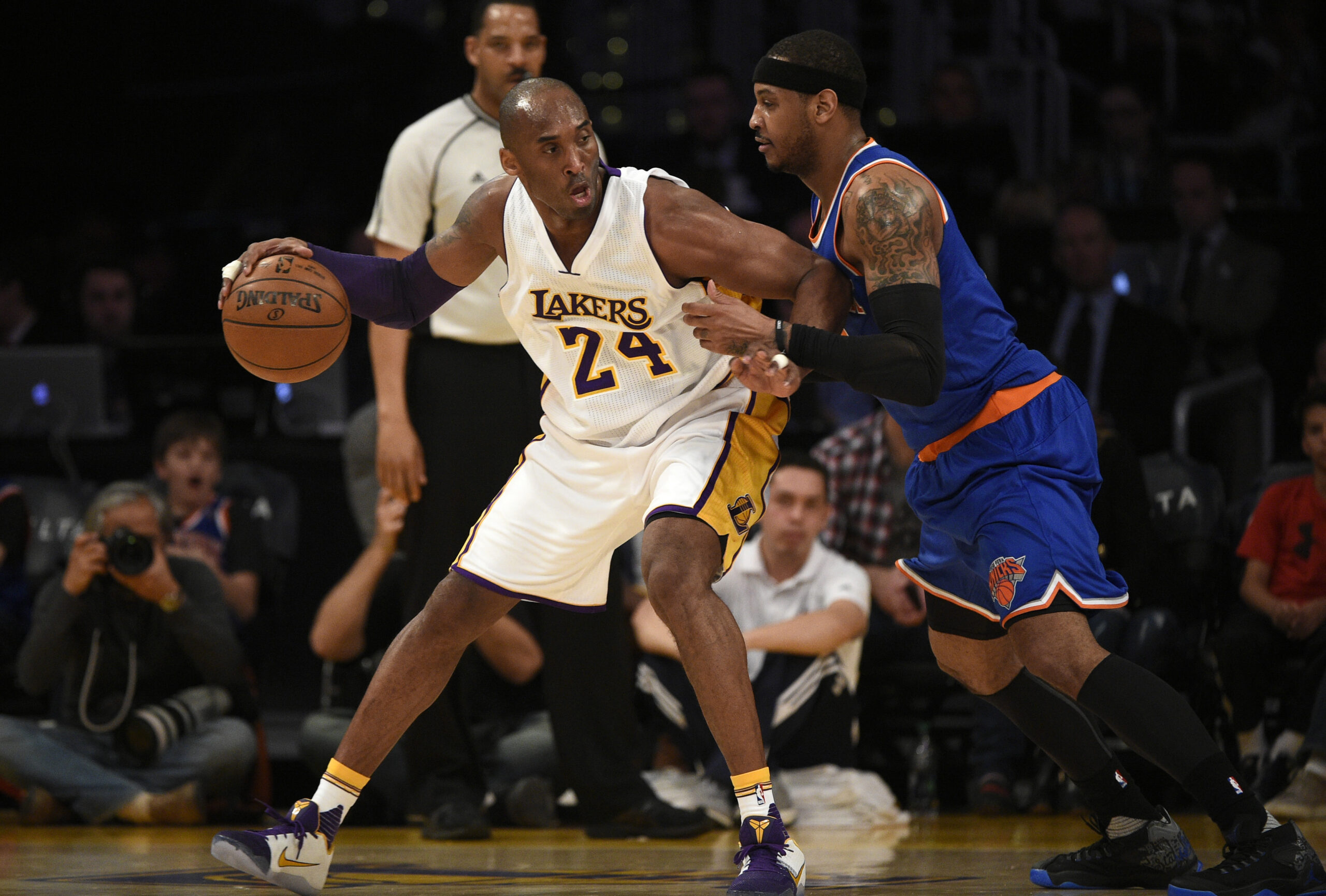 Mar 13, 2016; Los Angeles, CA, USA; Los Angeles Lakers forward Kobe Bryant (24) posts up on New York Knicks forward Carmelo Anthony (7) during the first quarter at Staples Center.