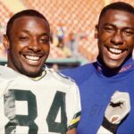 Green Bay Packers receiver Sterling Sharpe (left) poses with his younger brother Denver Broncos receiver Shannon Sharpe (right) at Mile High Stadium.