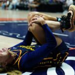 Indiana Fever guard Sophie Cunningham (8) on the court injured as they take on the Connecticut Sun in the first half at Mohegan Sun Arena.