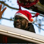 Basketball great Shaquille O’Neal waves during A Very GNV Holiday Parade at Downtown in Gainesville, FL on Saturday, December 7, 2024. The annual event attracts thousands of residents and features every thing from the grinch to the Fighting Gator Marching band. Shaquille O’Neal was the grand marshal and Santa waved from a firetruck at the end.