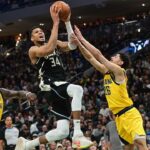 Milwaukee Bucks forward Giannis Antetokounmpo (34) takes a shot between Indiana Pacers forward Pascal Siakam (43) and guard Ben Sheppard (26) in the third quarter during game four of first round for the 2024 NBA Playoffs at Fiserv Forum