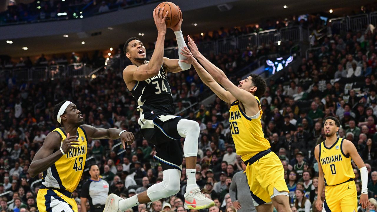 Milwaukee Bucks forward Giannis Antetokounmpo (34) takes a shot between Indiana Pacers forward Pascal Siakam (43) and guard Ben Sheppard (26) in the third quarter during game four of first round for the 2024 NBA Playoffs at Fiserv Forum
