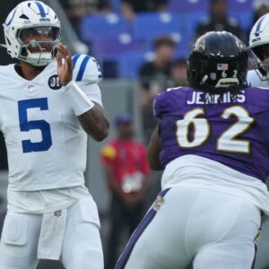 Indianapolis Colts quarterback Anthony Richardson Sr. (5) looks to pass during the first quarter pressured by Baltimore Ravens nose tackle John Jenkins (62) at M&T Bank Stadium.