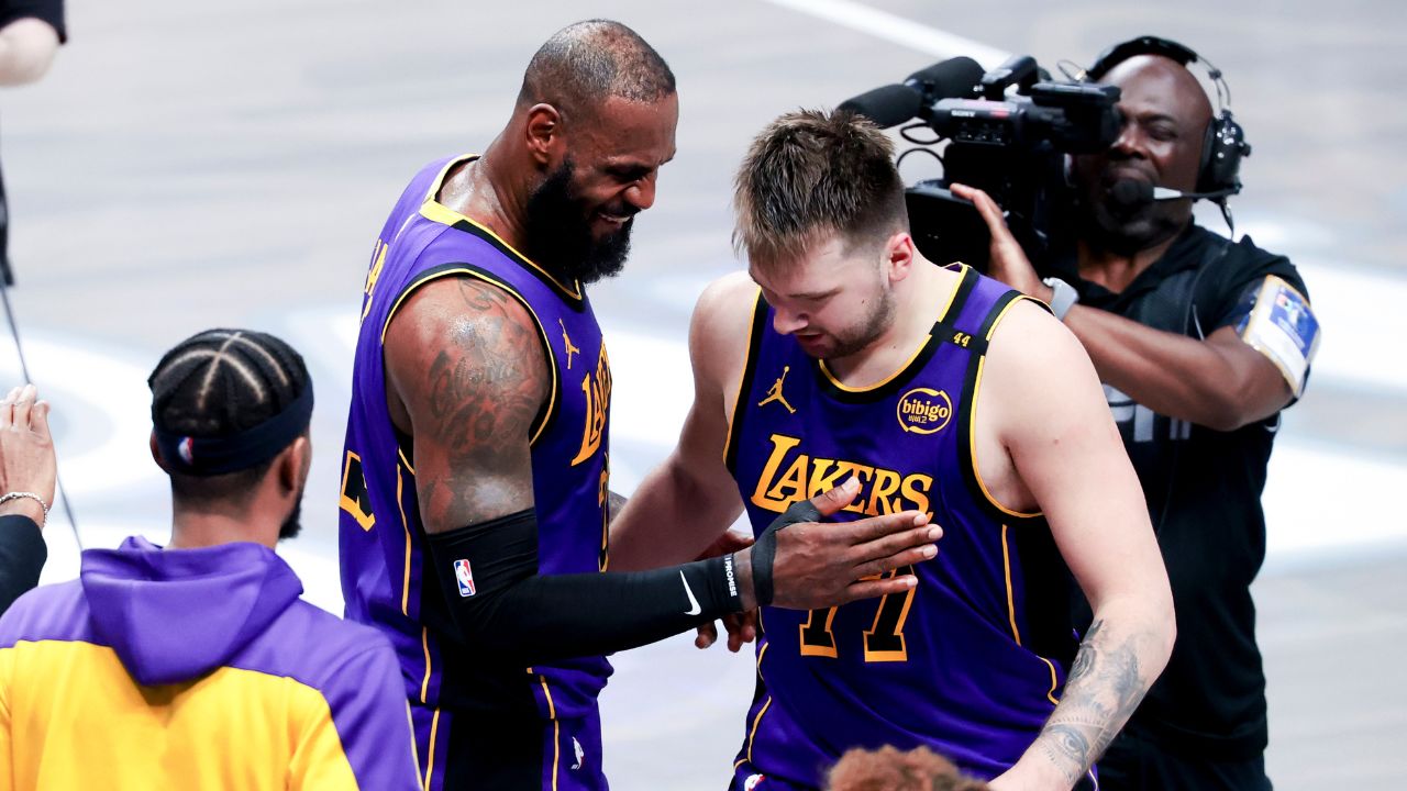 Los Angeles Lakers forward LeBron James (23) celebrates with Los Angeles Lakers guard Luka Doncic (77) during the fourth quarter against the Dallas Mavericks at American Airlines Center.