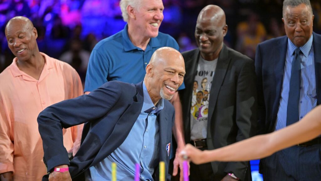 Byron Scott, Bill Walton, Michael Cooper and Jamal Wilkes look on as birthday candles are lit to celebrate Los Angeles Lakers Hall of Famers Kareem Abdul-Jabbar 75th birthday during halftime during the game between the Los Angeles Lakers and the Oklahoma City Thunder at Crypto.com Arena.