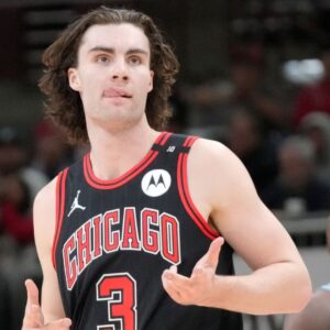 Apr 9, 2025; Chicago, Illinois, USA; Chicago Bulls guard Josh Giddey (3) reacts after making a three point basket against the Miami Heat during the second half at United Cente