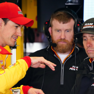 Feb 18, 2023; Daytona Beach, Florida, USA; NASCAR Cup Series driver Joey Logano (22) talks with crew chief Paul Wolfe in his garage stall following practice for the Daytona 500 at Daytona International Speedway. Mandatory Credit: John David Mercer-Imagn Images
