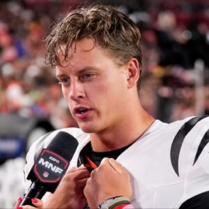 Cincinnati Bengals quarterback Joe Burrow (9) is interviewed by sideline reporter Laura Rutledge in the third quarter of the NFL Preseason Week 2 game between the Washington Commanders and the Cincinnati Bengals at Northwest Stadium in Landover, Md., on Monday, Aug. 18, 2025. The Bengals won the game, 31-17.