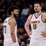 Denver Nuggets guard Jamal Murray (27) reacts after a call as center Nikola Jokic (15) looks on in the third quarter against the Portland Trail Blazers at Ball Arena.