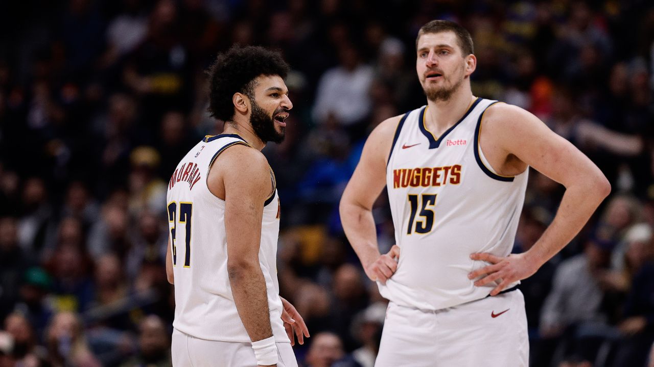 Denver Nuggets guard Jamal Murray (27) reacts after a call as center Nikola Jokic (15) looks on in the third quarter against the Portland Trail Blazers at Ball Arena.