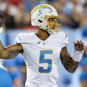 Jul 31, 2025; Canton, Ohio, USA; Los Angeles Chargers quarterback Trey Lance (5) throws in the second quarter against the Detroit Lions at Tom Benson Hall of Fame Stadium.