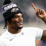 Aug 16, 2025; Arlington, Texas, USA; Baltimore Ravens quarterback Lamar Jackson (8) warms up before the game against the Dallas Cowboys at AT&T Stadium.