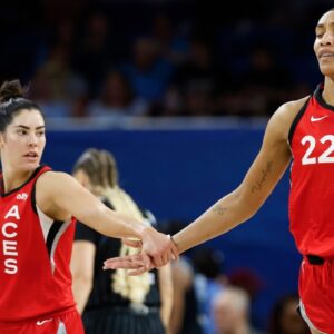 Las Vegas Aces center A'ja Wilson (22) is congratulated by guard Kelsey Plum (10) after scoring against the Chicago Sky during the first half at Wintrust Arena.
