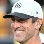 Pittsburgh Steelers quarterback Aaron Rodgers (8) watches introductions during a game against the Tampa Bay Buccaneers at Acrisure Stadium.