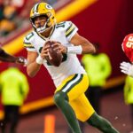 Green Bay Packers quarterback Jordan Love (10) runs past Kansas City Chiefs defensive end Melvin Ingram III (24) and defensive end Chris Jones (95) during the first half at GEHA Field at Arrowhead Stadium.