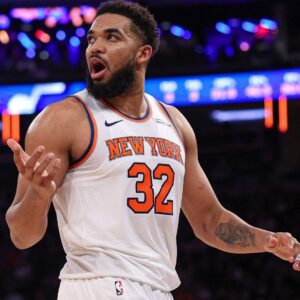 Jan 1, 2025; New York, New York, USA; New York Knicks center Karl-Anthony Towns (32) reacts during the second half against the Utah Jazz at Madison Square Garden.
