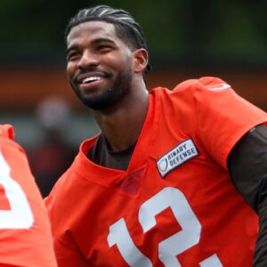 Browns quarterbacks Shedeur Sanders (12), Kenny Pickett (8) and Joe Flacco (15) talk during minicamp June 10, 2025, in Berea.
