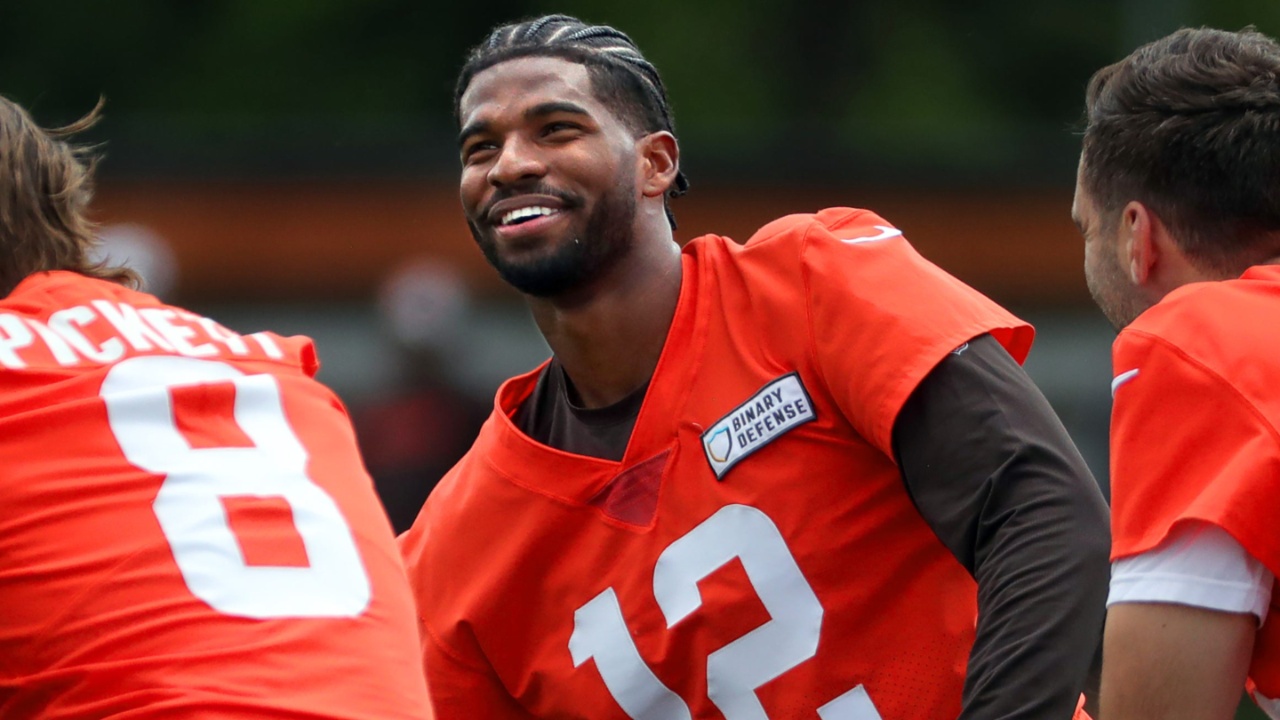 Browns quarterbacks Shedeur Sanders (12), Kenny Pickett (8) and Joe Flacco (15) talk during minicamp June 10, 2025, in Berea.