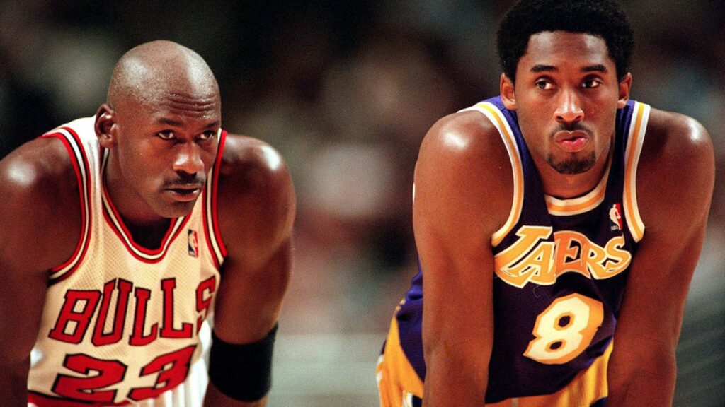Michael Jordan has a chat with the Lakers Kobe Bryant during free throws in 1997