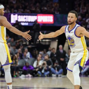 Golden State Warriors guard Stephen Curry (30) celebrates with guard Moses Moody (4) during the fourth quarter against the Sacramento Kings at Golden 1 Center.