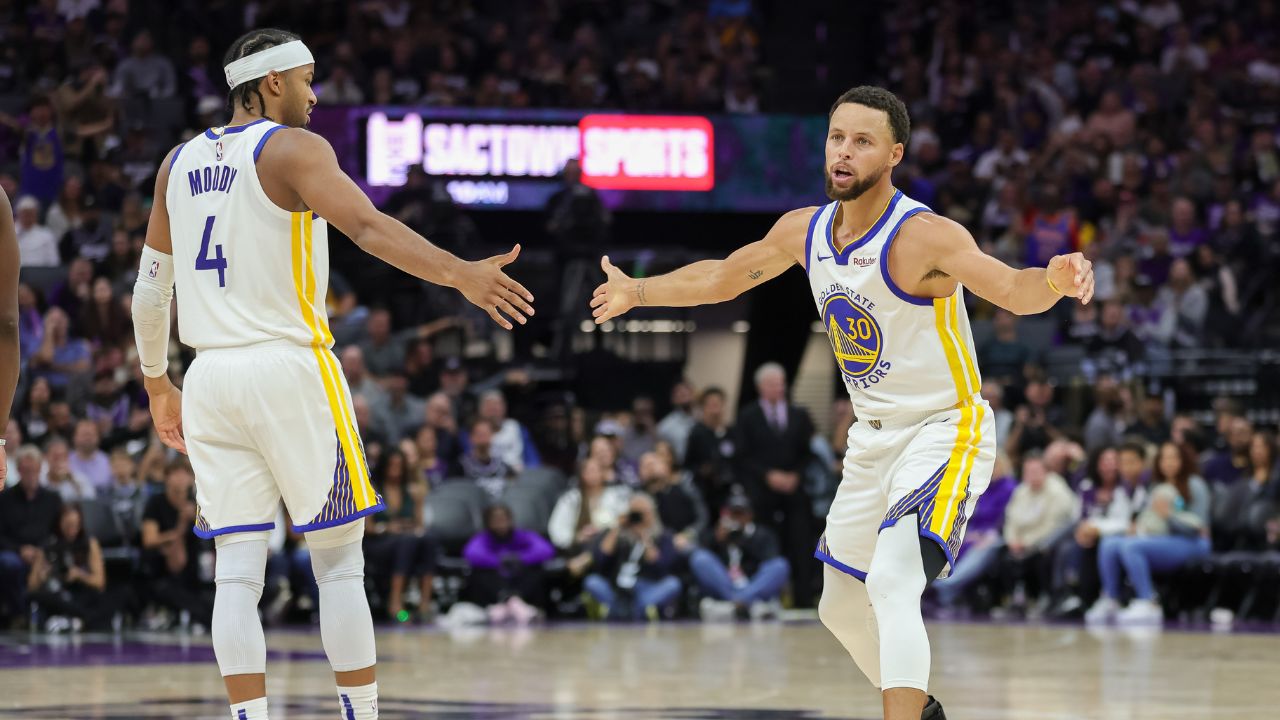 Golden State Warriors guard Stephen Curry (30) celebrates with guard Moses Moody (4) during the fourth quarter against the Sacramento Kings at Golden 1 Center.