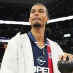 San Antonio Spurs center Victor Wembanyama (1) prepares to throw a ball in to the stands in celebration of Fan Appreciation Day after a victory over the Toronto Raptors at Frost Bank Center.