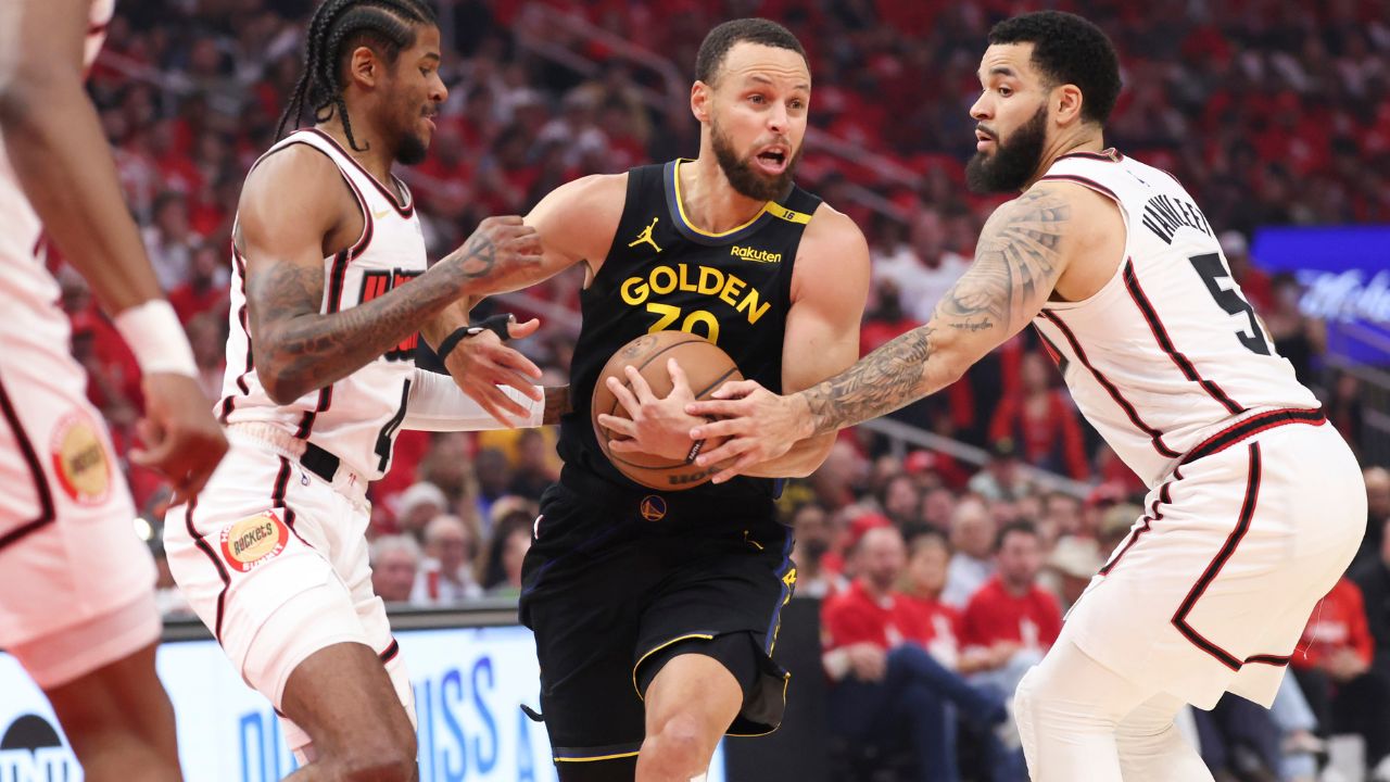 Golden State Warriors guard Stephen Curry (30) controls the ball as Houston Rockets guard Jalen Green (4) and guard Fred VanVleet (5) defend during the first quarter of game seven of the first round for the 2025 NBA Playoffs at Toyota Center.