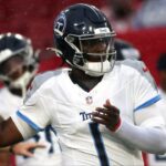 Tennessee Titians quarterback Cam Ward (1) works out prior to the game against the Tampa Bay Buccaneers at Raymond James Stadium.
