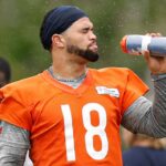 Chicago Bears quarterback Caleb Williams (18) cools off during minicamp at Halas Hall.