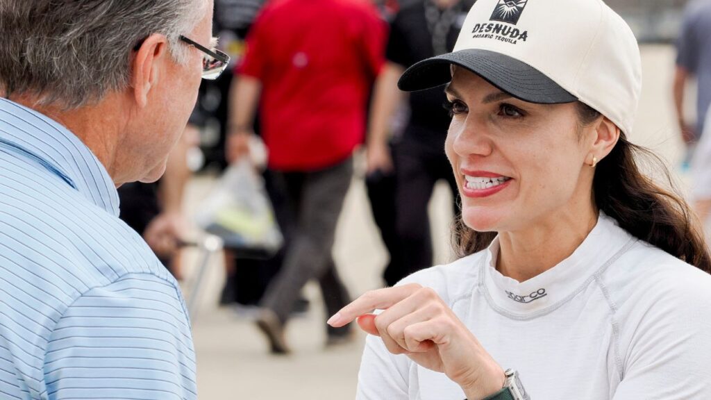 NASCAR Xfinity Series driver Katherine Legge (32) talks Saturday, July 26, 2025, ahead of qualifying for the Pennzoil 250 at Indianapolis Motor Speedway.