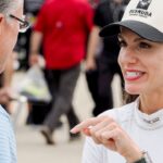 NASCAR Xfinity Series driver Katherine Legge (32) talks Saturday, July 26, 2025, ahead of qualifying for the Pennzoil 250 at Indianapolis Motor Speedway.