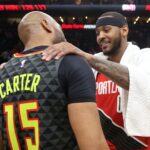 Feb 29, 2020; Atlanta, Georgia, USA; Portland Trail Blazers forward Carmelo Anthony (00, right) greets Atlanta Hawks guard Vince Carter (15) after their game at State Farm Arena.