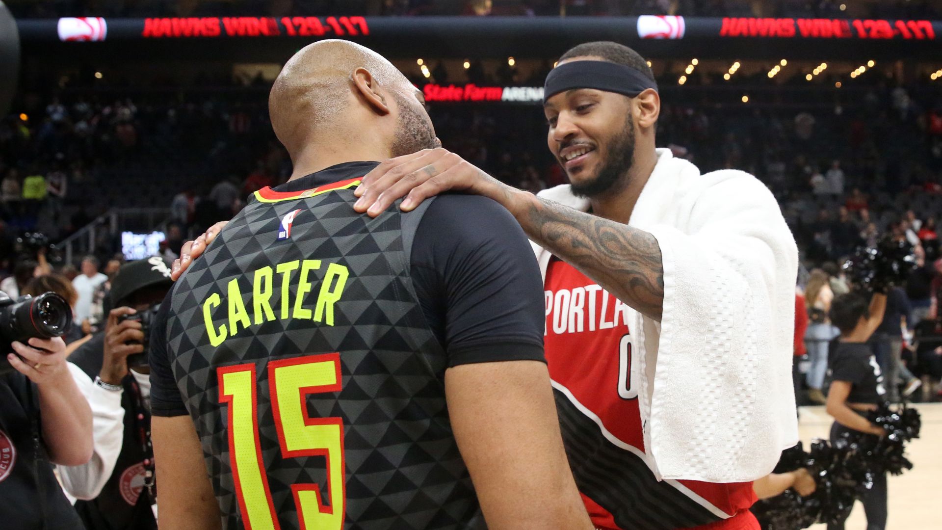 Feb 29, 2020; Atlanta, Georgia, USA; Portland Trail Blazers forward Carmelo Anthony (00, right) greets Atlanta Hawks guard Vince Carter (15) after their game at State Farm Arena.