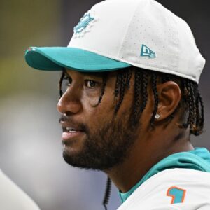 Miami Dolphins starting quarterback Tua Tagovailoa (1) on the sidelines during the Dolphins preseason game against the Detroit Lions in the fourth quarter at Ford Field.