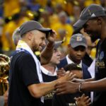 The Golden State Warriors Stephen Curry and Kevin Durant, right, celebrate after defeating the Cleveland Cavaliers, 129-120, in Game 5 of the NBA Finals at Oracle Arena in Oakland, Calif.