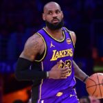 Los Angeles Lakers forward LeBron James (23) dribbles the ball against the Dallas Mavericks during the second half at Crypto.com Arena.