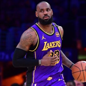 Los Angeles Lakers forward LeBron James (23) dribbles the ball against the Dallas Mavericks during the second half at Crypto.com Arena.