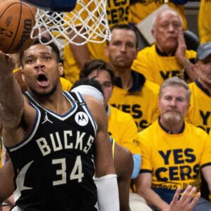 Milwaukee Bucks forward Giannis Antetokounmpo (34) shoots the ball while Indiana Pacers guard Andrew Nembhard (2) defends during game five of the first round for the 2024 NBA Playoffs at Gainbridge Fieldhouse.