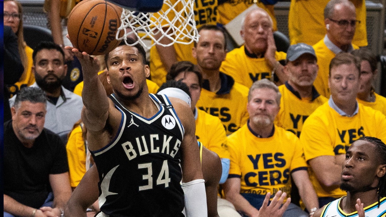 Milwaukee Bucks forward Giannis Antetokounmpo (34) shoots the ball while Indiana Pacers guard Andrew Nembhard (2) defends during game five of the first round for the 2024 NBA Playoffs at Gainbridge Fieldhouse.