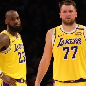 Los Angeles Lakers forward LeBron James (23) and guard Luka Doncic (77) during the second quarter against the Charlotte Hornets at Crypto.com Arena.
