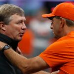 Georgia coach Kirby Smart and Clemson head coach Dabo Swinney speak before the start of the NCAA Aflac Kickoff Game in Atlanta, on Saturday, Aug. 31, 2024.